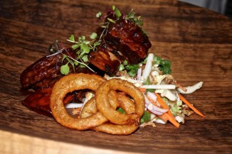 Vietnamese Braised Beef Short Ribs with Urban slaw, coriander, fried shallots and onion rings.